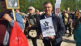 Полиция навестила активиста, звавшего ставить свечи за «упокой латвийской демократии»
